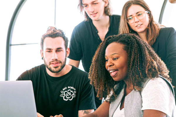 students looking at laptop