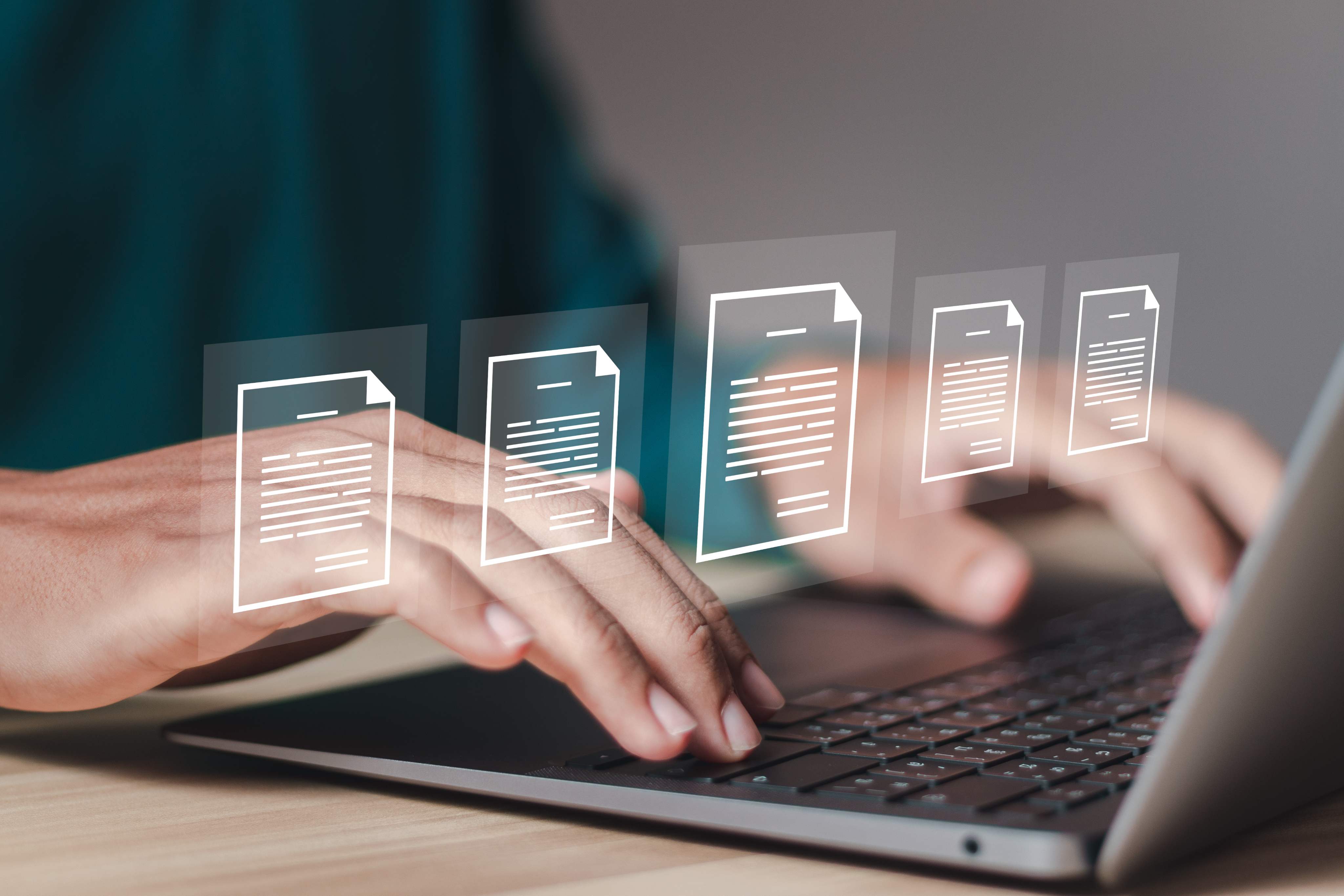 businessman using laptop with documents